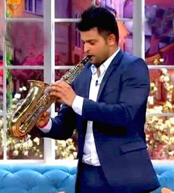 Suresh Raina playing saxophone