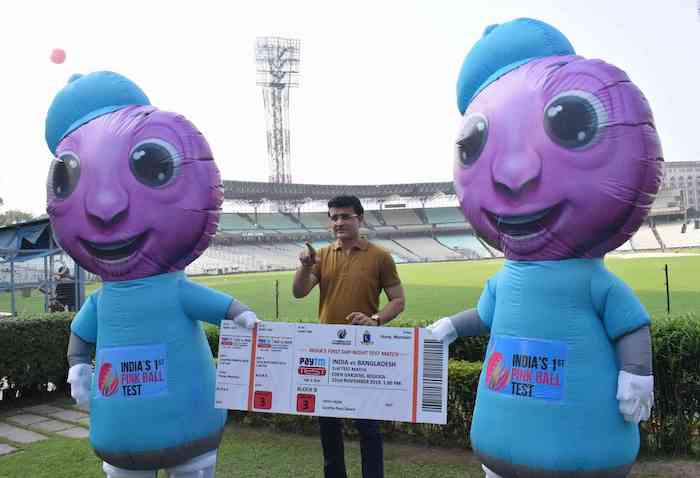 BCCI president Sourav Ganguly displays a blown-up ticket alongside the mascots for the match