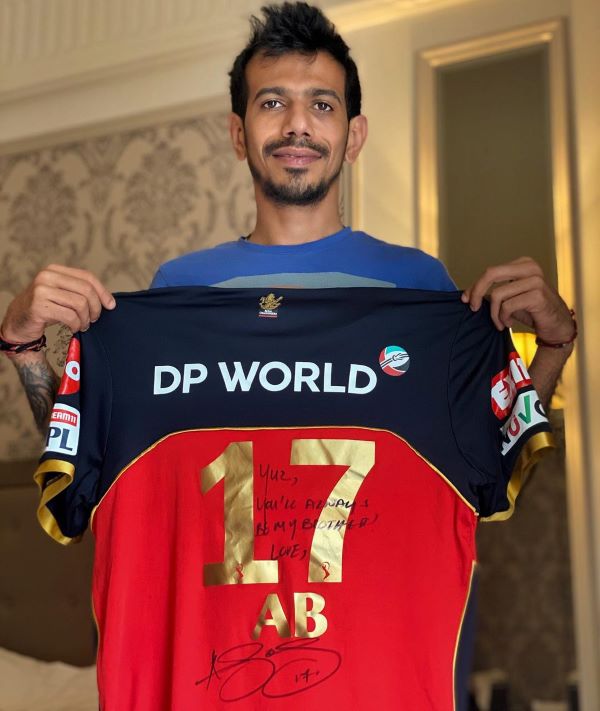 Yuzvendra chahal with signed jersey of ABD