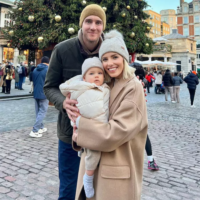 Stuart Broad with his partner and their baby