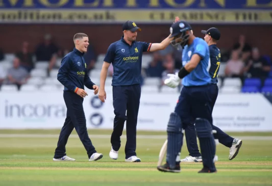 Celebration of first wicket on debut game for Warwickshire