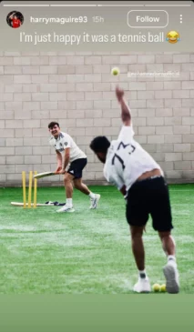Harry Maguire with Mohammed Siraj